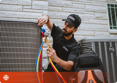 PRT-Cooling-CTA Precision Today technician connecting refrigerant gauges to an outdoor air conditioning unit