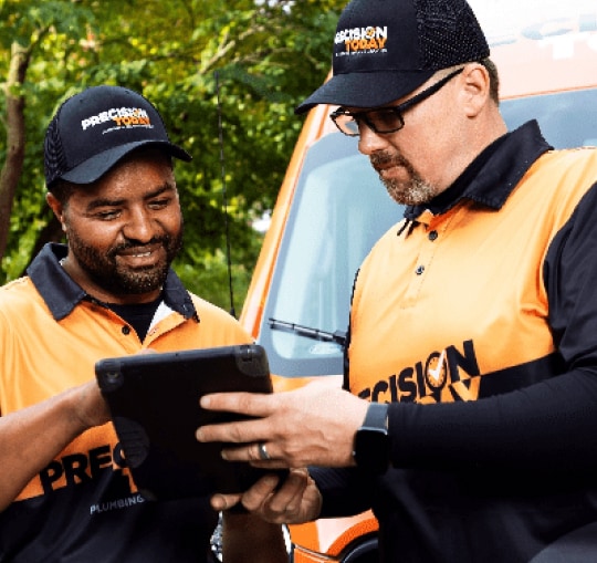 local HVAC technicians reviewing work