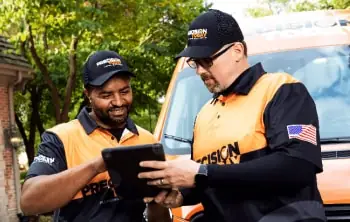 local HVAC technicians reviewing work
