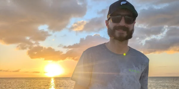 Drain tech at beach showing his work-life balance